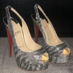 Louboiton Red bottom Heels. Silver tiger print.